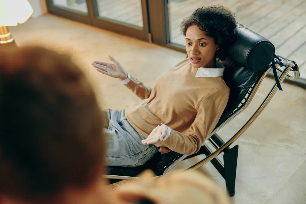 Patient speaks with Mental Health Therapist about a recent event that caused distress.